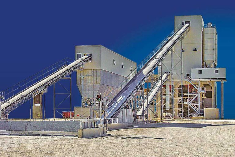 Twin shaft mixer inside NCONMAC stationary concrete batching plant ensuring uniform concrete mixing